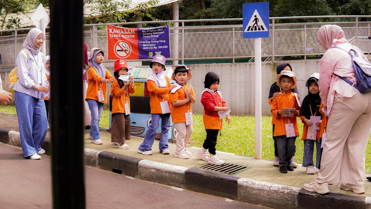 Children learning road safety and pedestrian rules at Taman Lalu Lintas Bandung